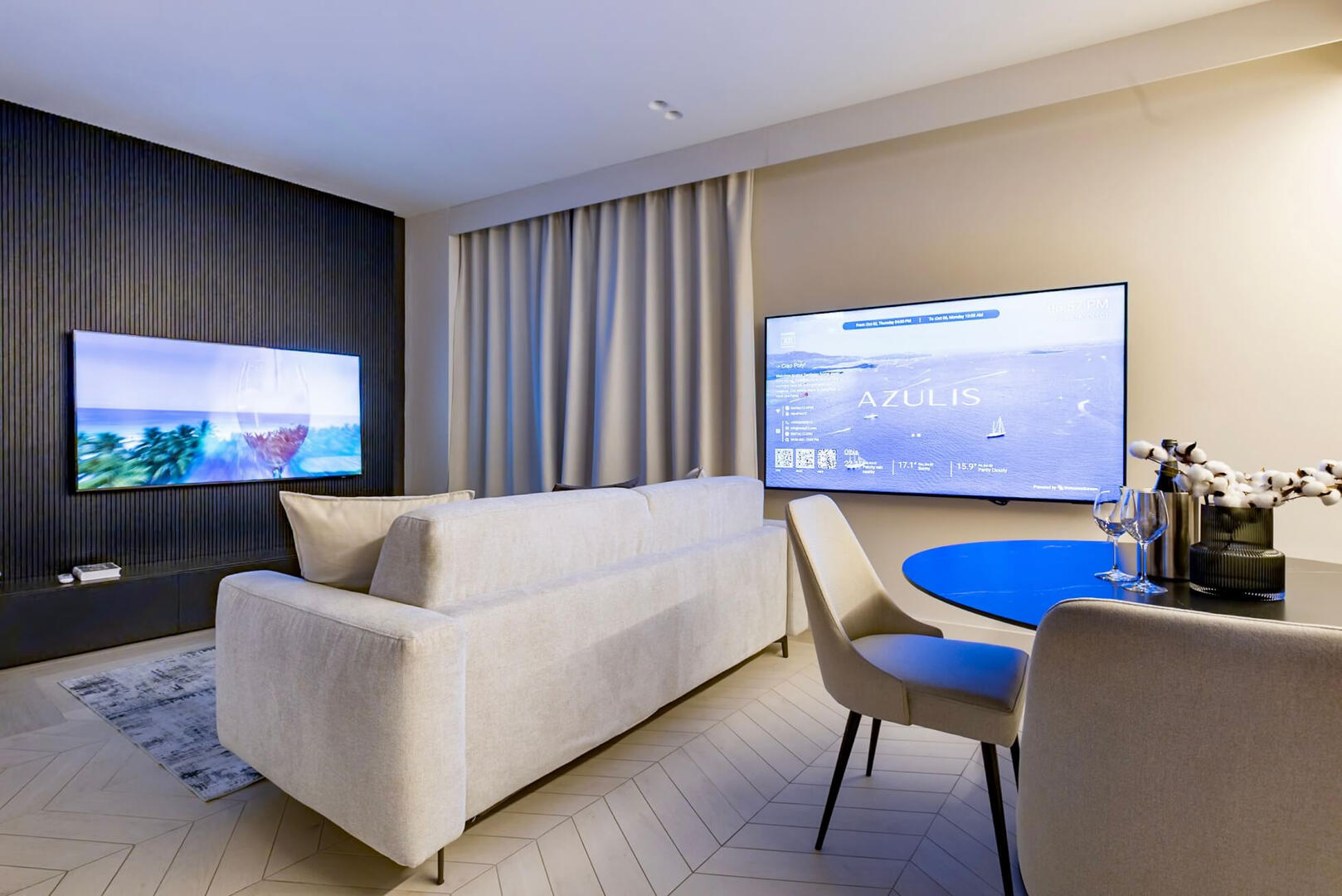 Elegant living room with sofa bed, smart TV, and warm lighting, comfort meets style in Olbia.