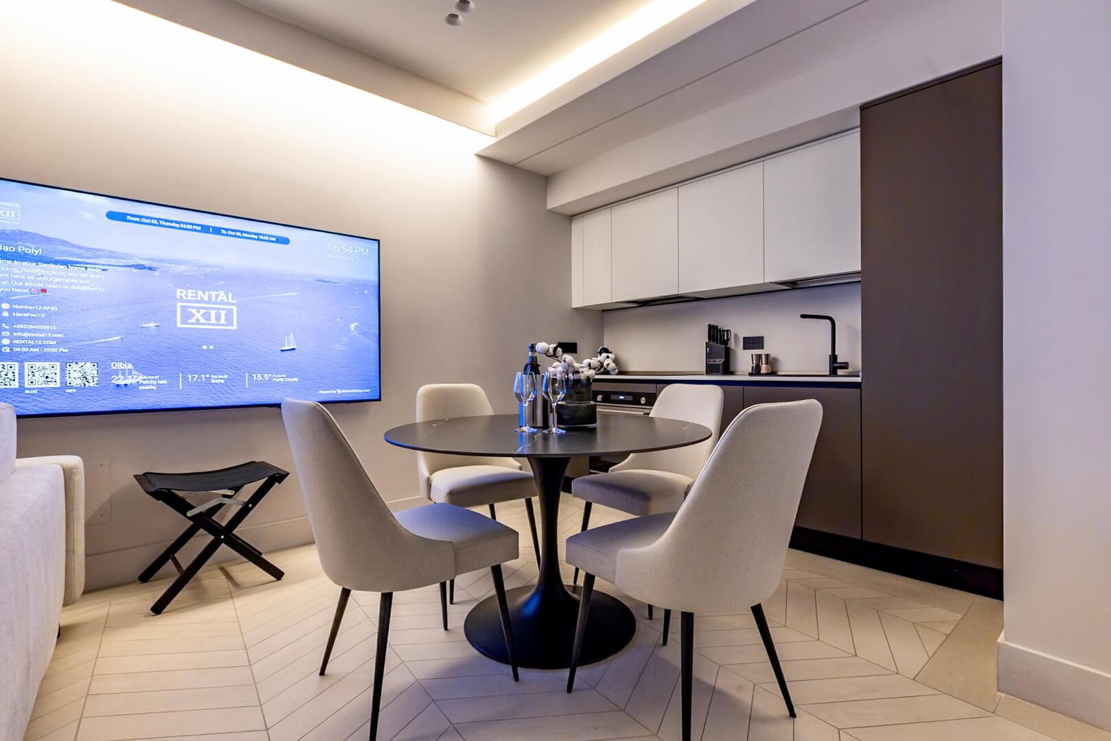 Chic dining space for four, ideal for relaxed breakfasts or intimate Sardinian dinners.